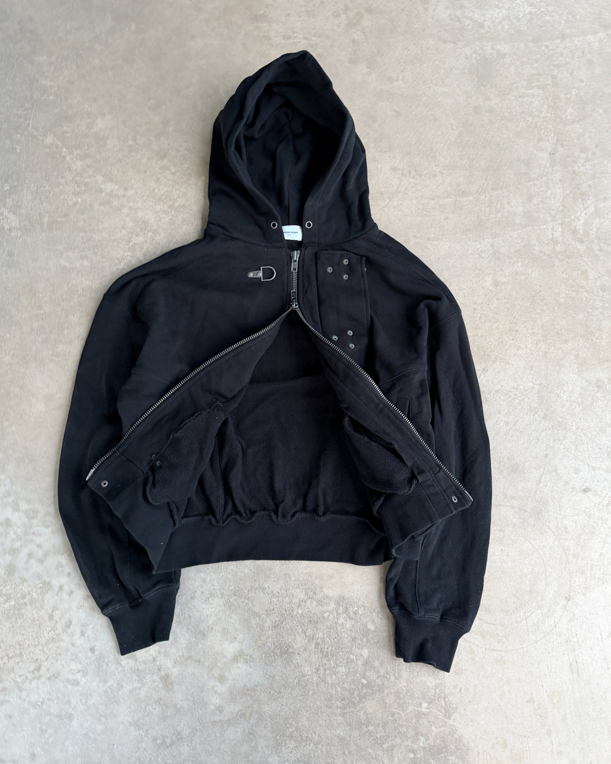 Ander Hunk Fireman Clasp Hoodie – M-on a concrete background