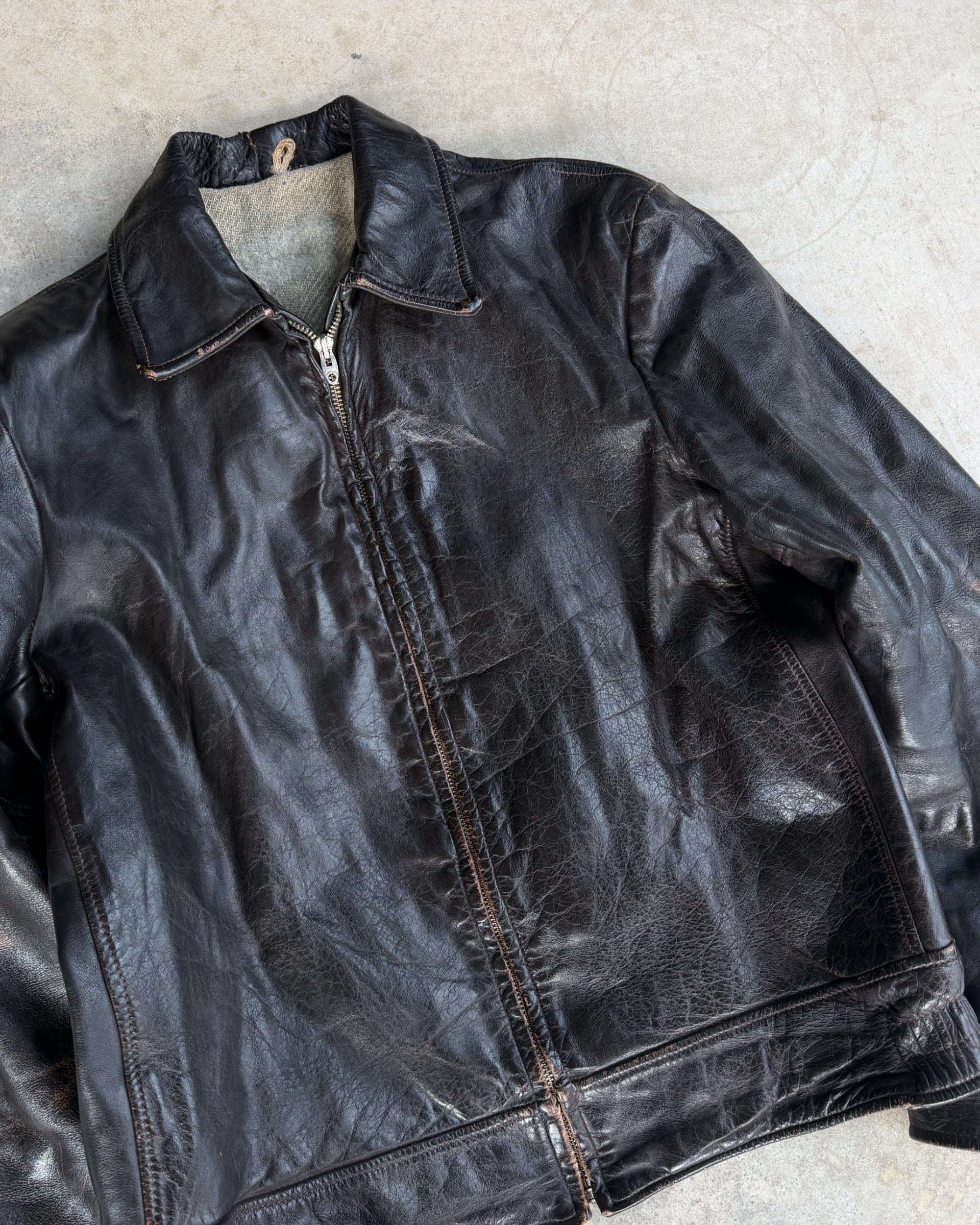 1970s Vintage Leather Jacket with Wool Lining – S-on a concrete background