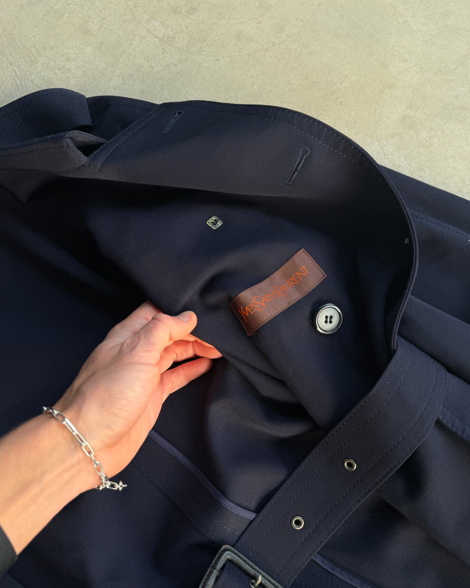 Yves Saint Laurent Wool Double Breasted Mac Coat – M-on a concrete background