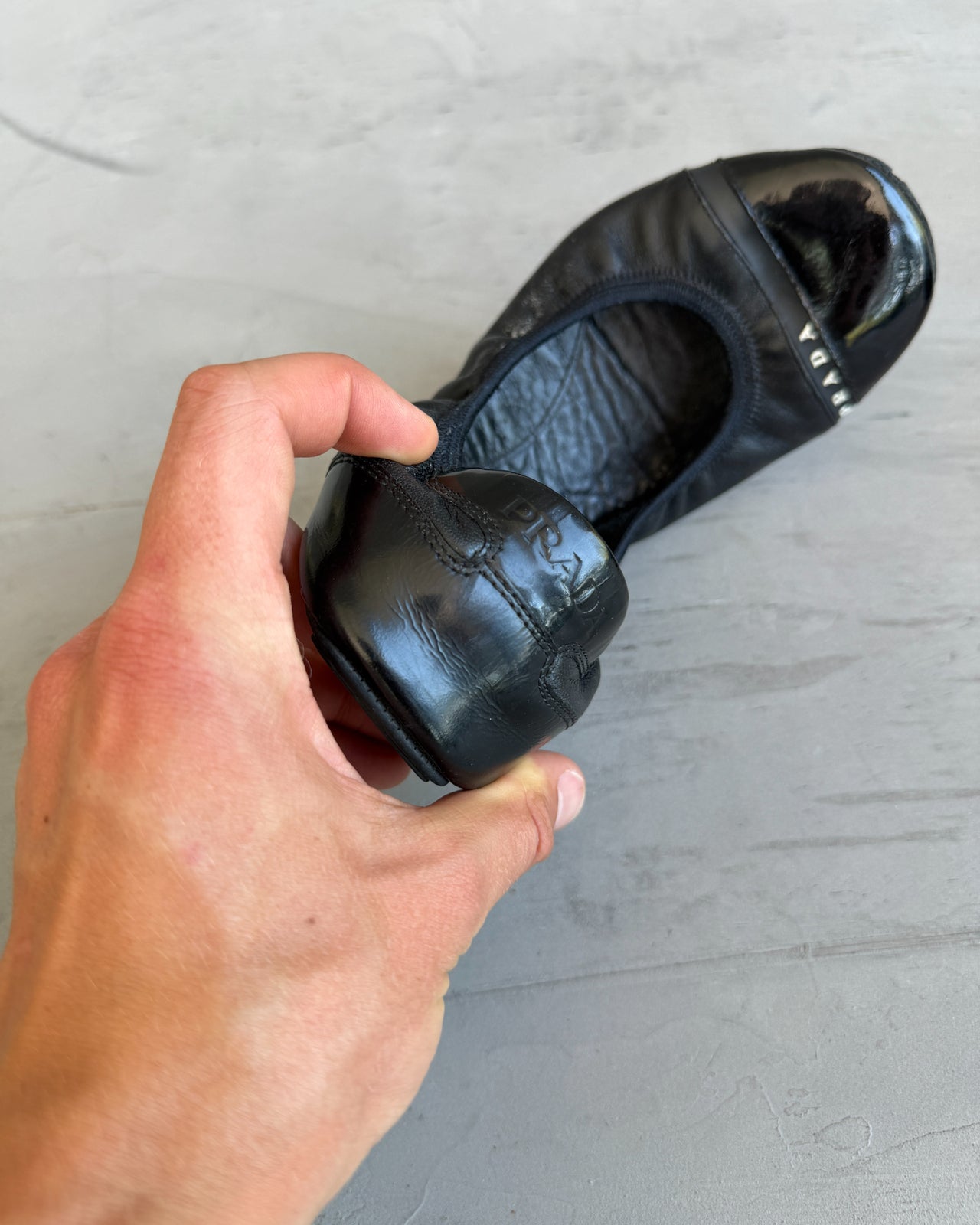 Prada Black Leather Ballet Flat – EU 37.5-on a concrete background