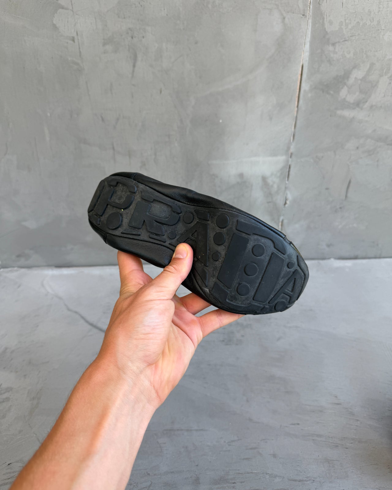 Prada Black Leather Ballet Flat – EU 37.5-on a concrete background