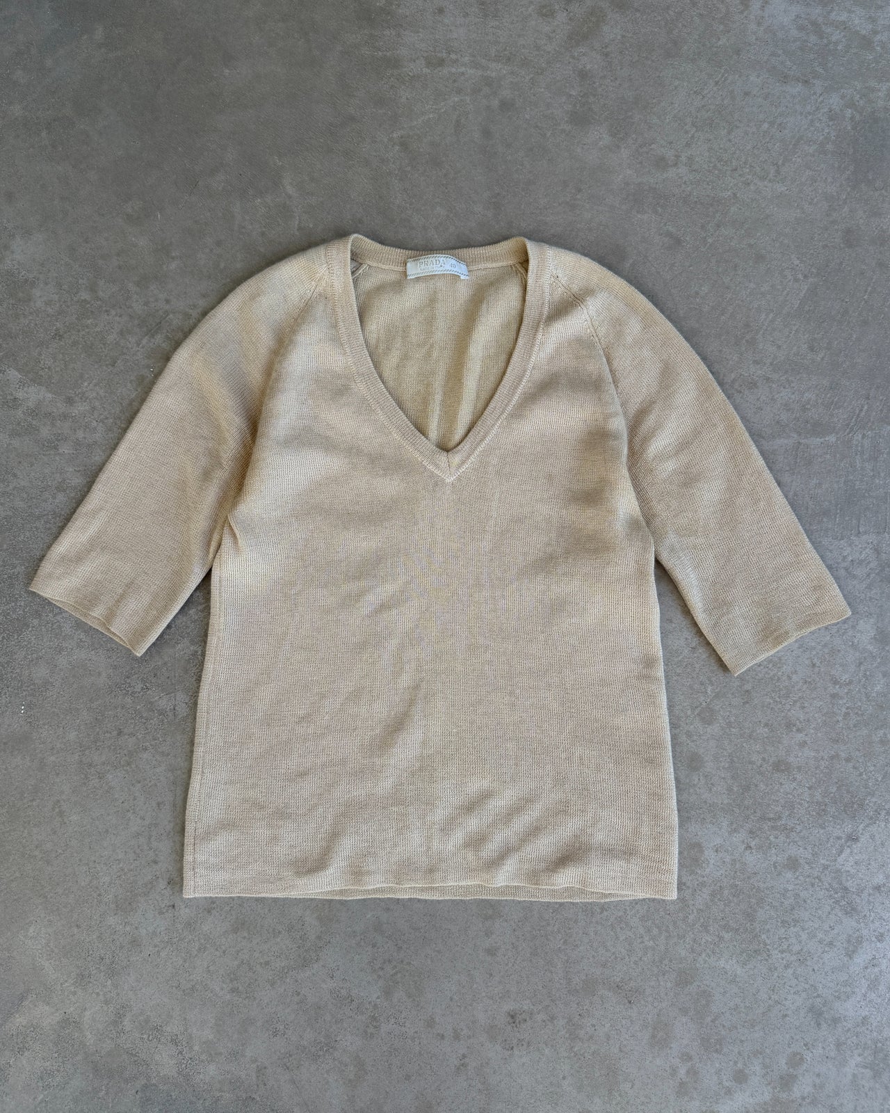 Prada Cashmere Silk Blend V Neck T-Shirt – S-on a concrete background