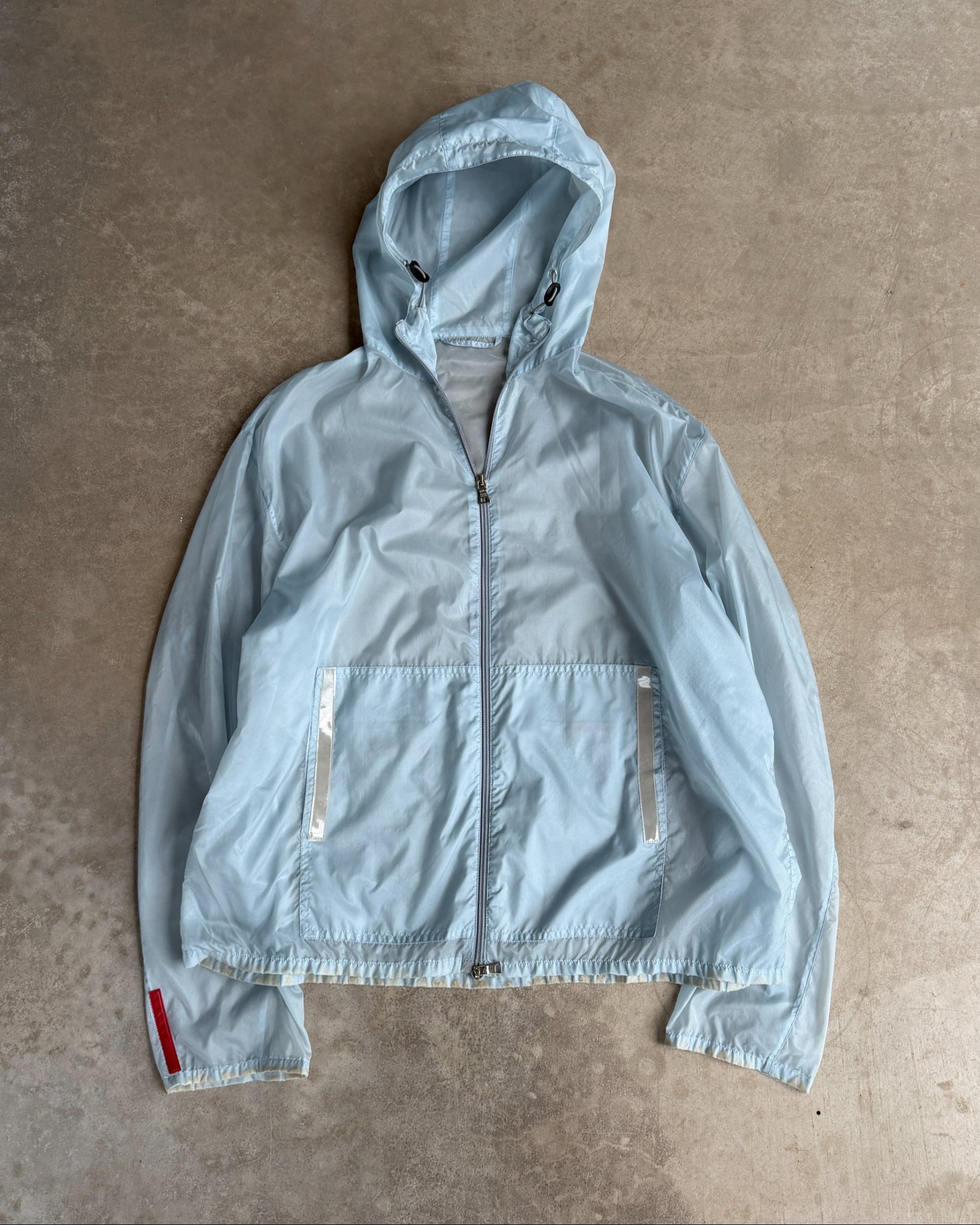 Prada SS99 Transparent Nylon Jacket – XL-on a concrete background