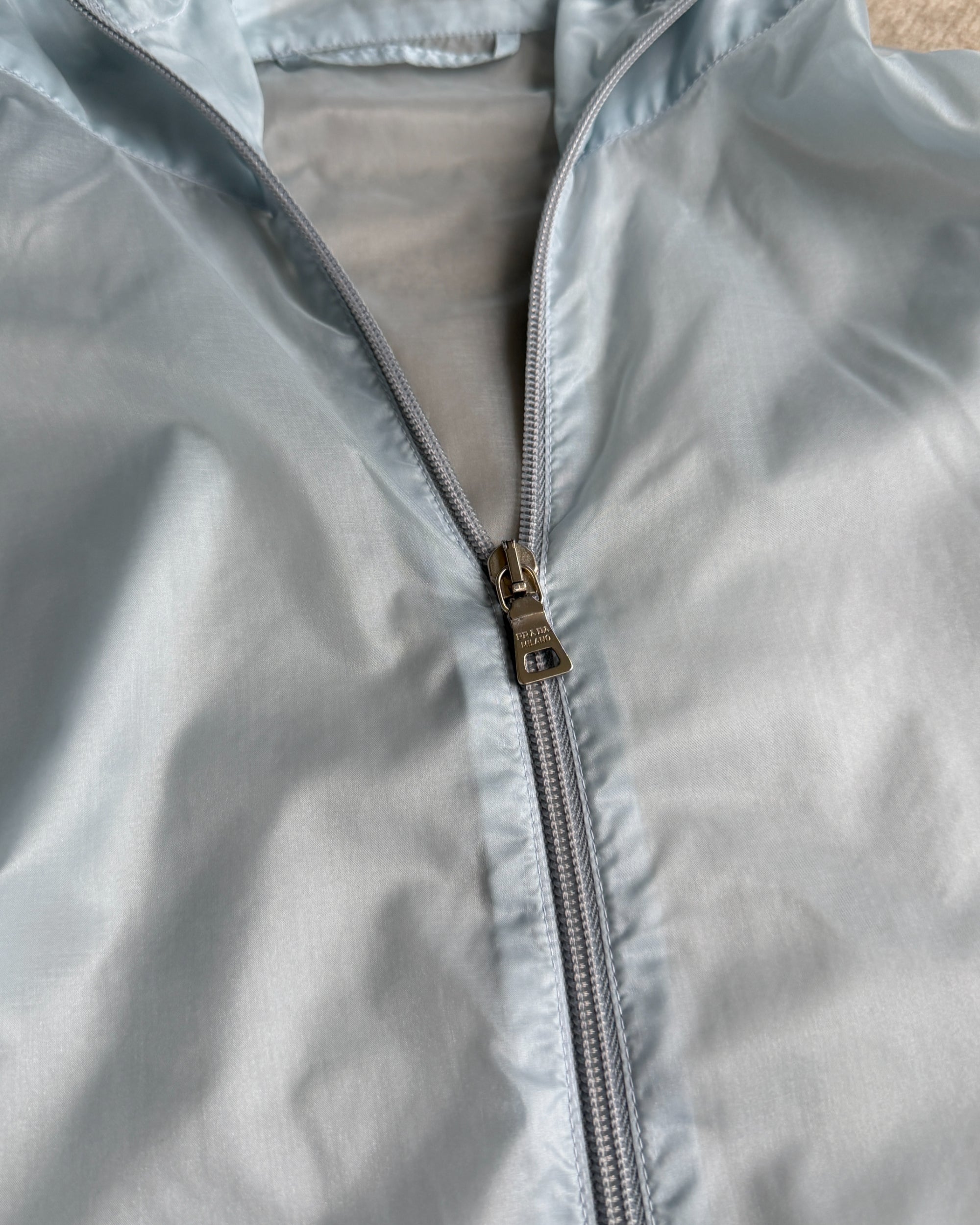 Prada SS99 Transparent Nylon Jacket – XL-on a concrete background