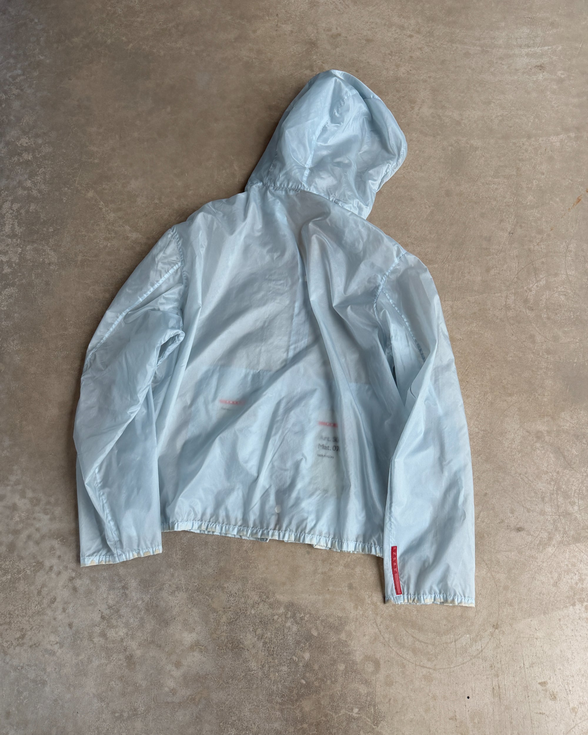 Prada SS99 Transparent Nylon Jacket – XL-on a concrete background
