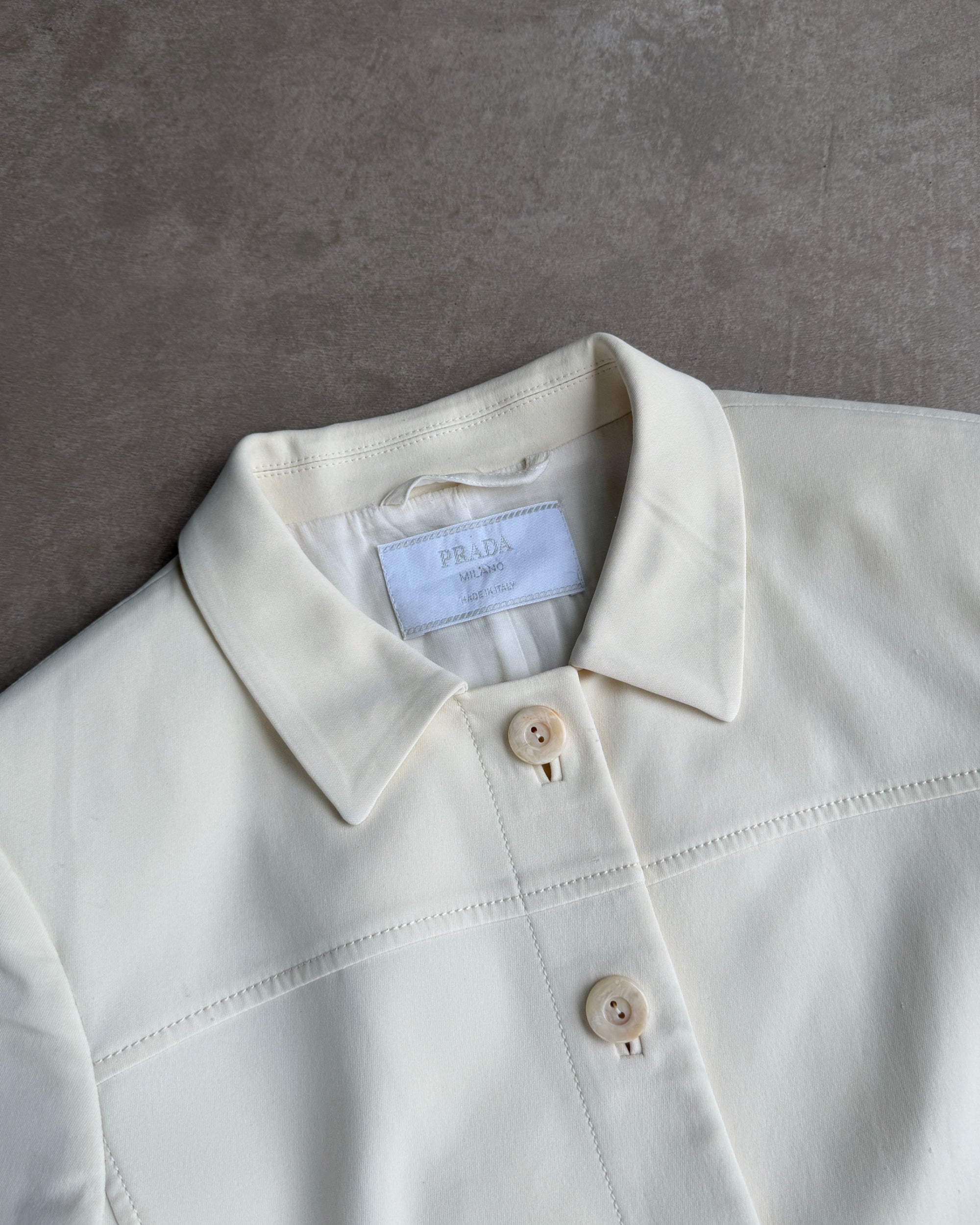 Prada Padded Shoulder Short Sleeve Shirt – M-on a concrete background