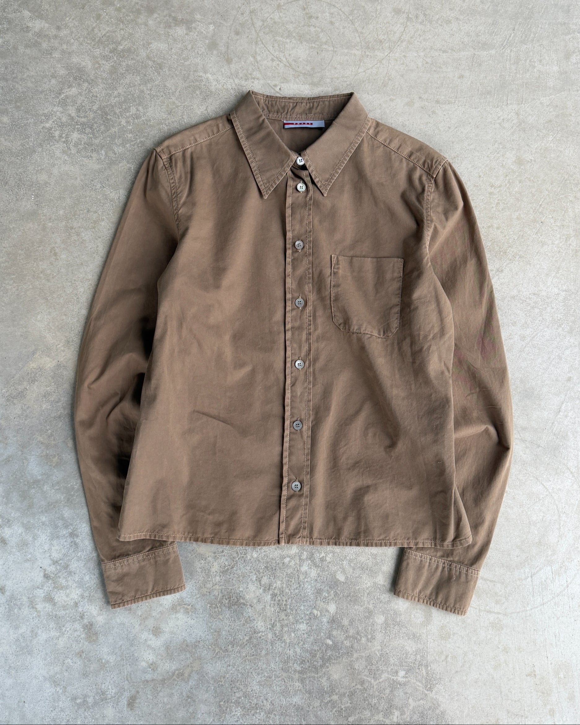 Prada Brown Cotton Shirt – S-on a concrete background