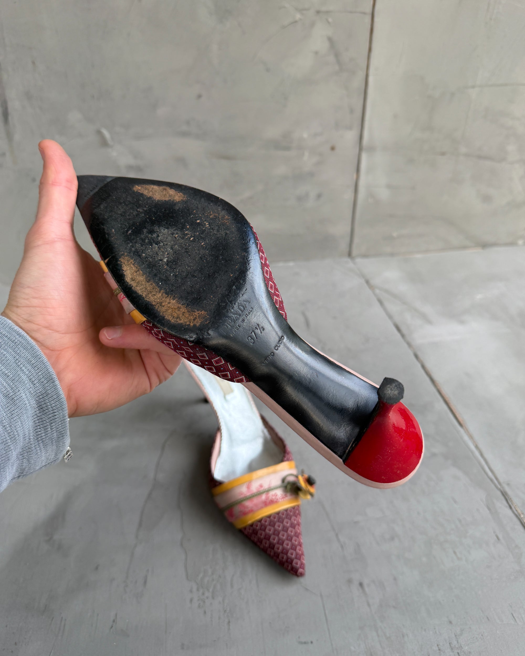 Prada Silk Embellished Kitten Heels – EU 37.5-on a concrete background