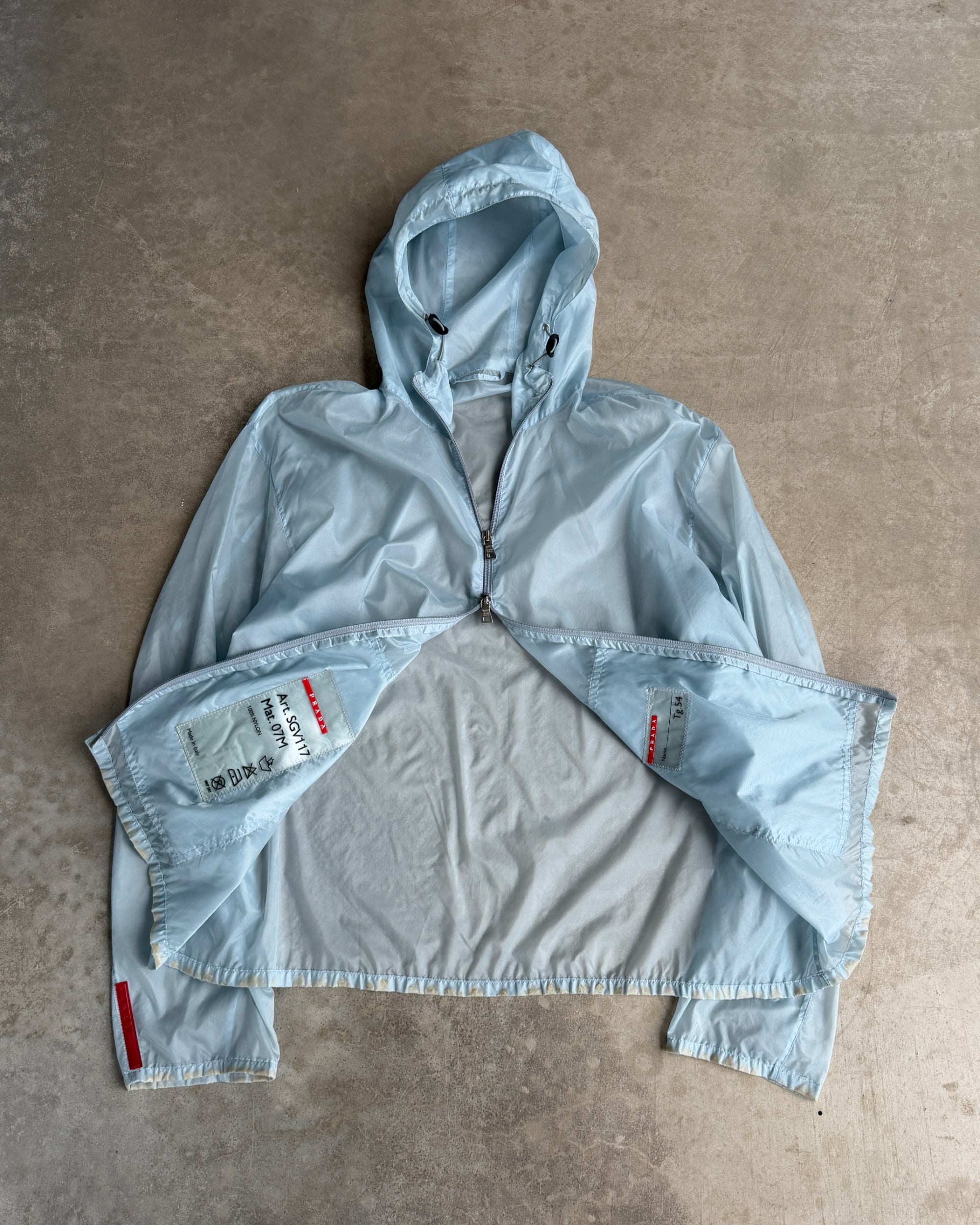 Prada SS99 Transparent Nylon Jacket – XL-on a concrete background