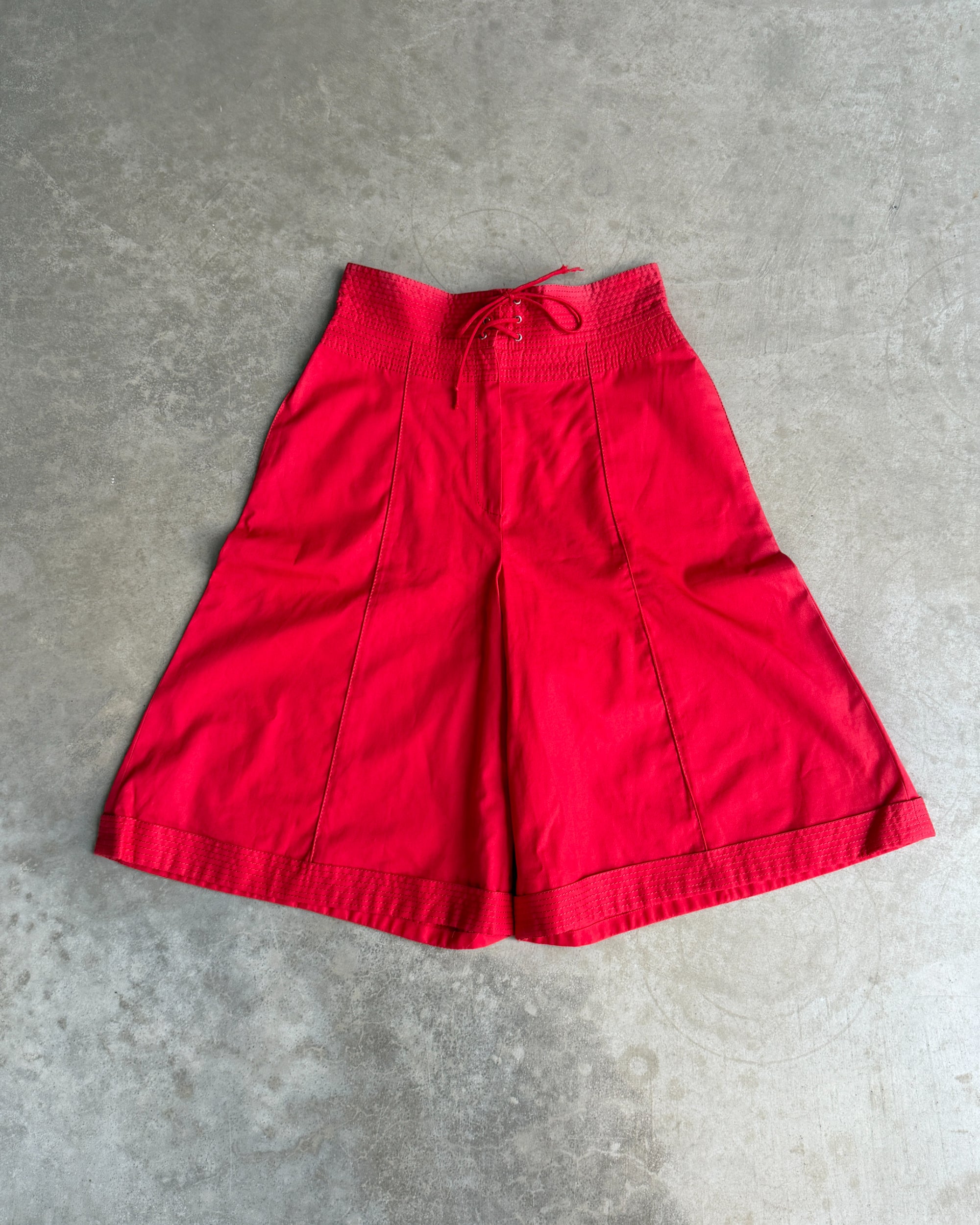 Gianfranco Ferre Cotton Shorts – S-on a concrete background