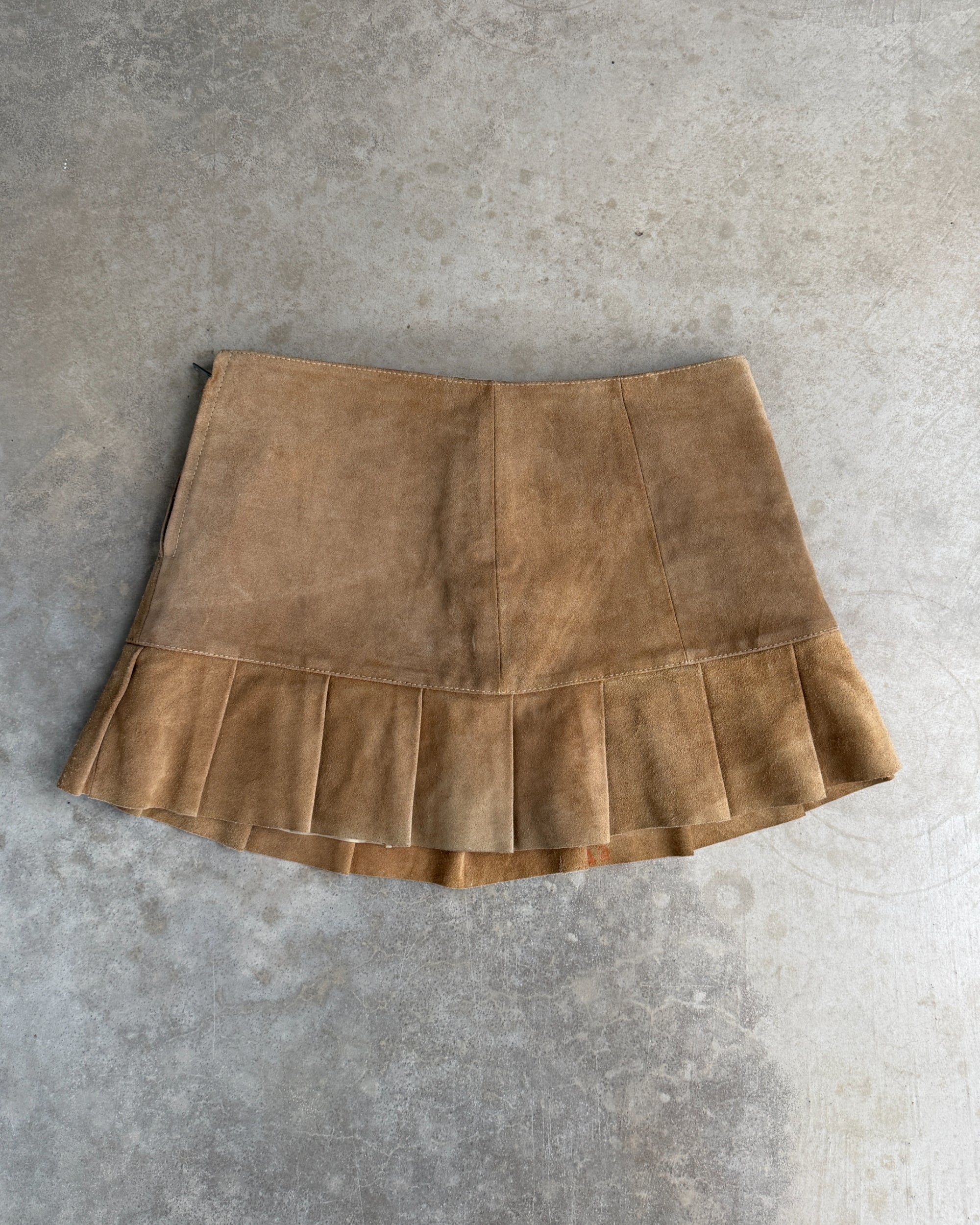 Leather Belted Mini Skirt – M-on a concrete background