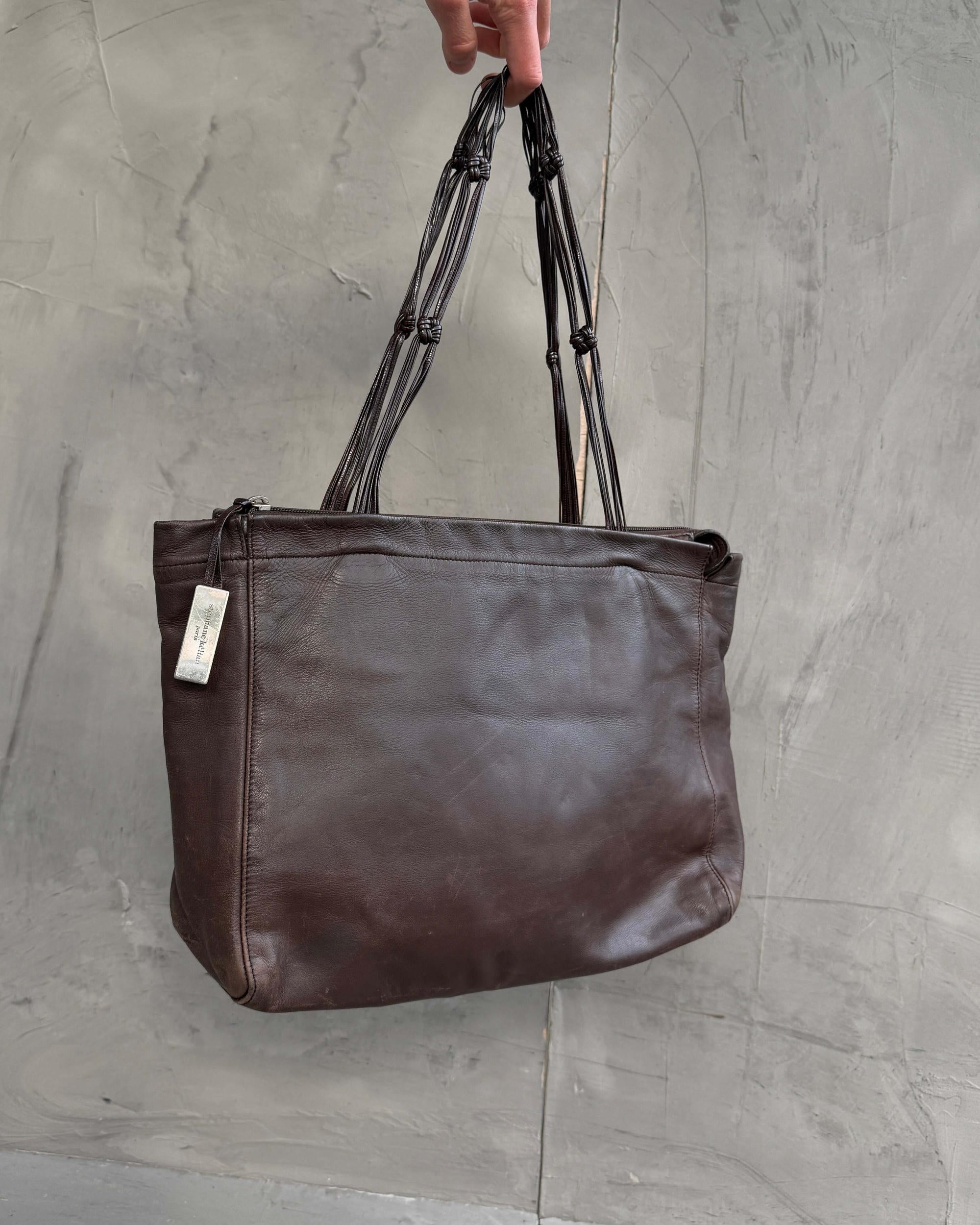 Stephane Kellan Leather Tote Bag-on a concrete background