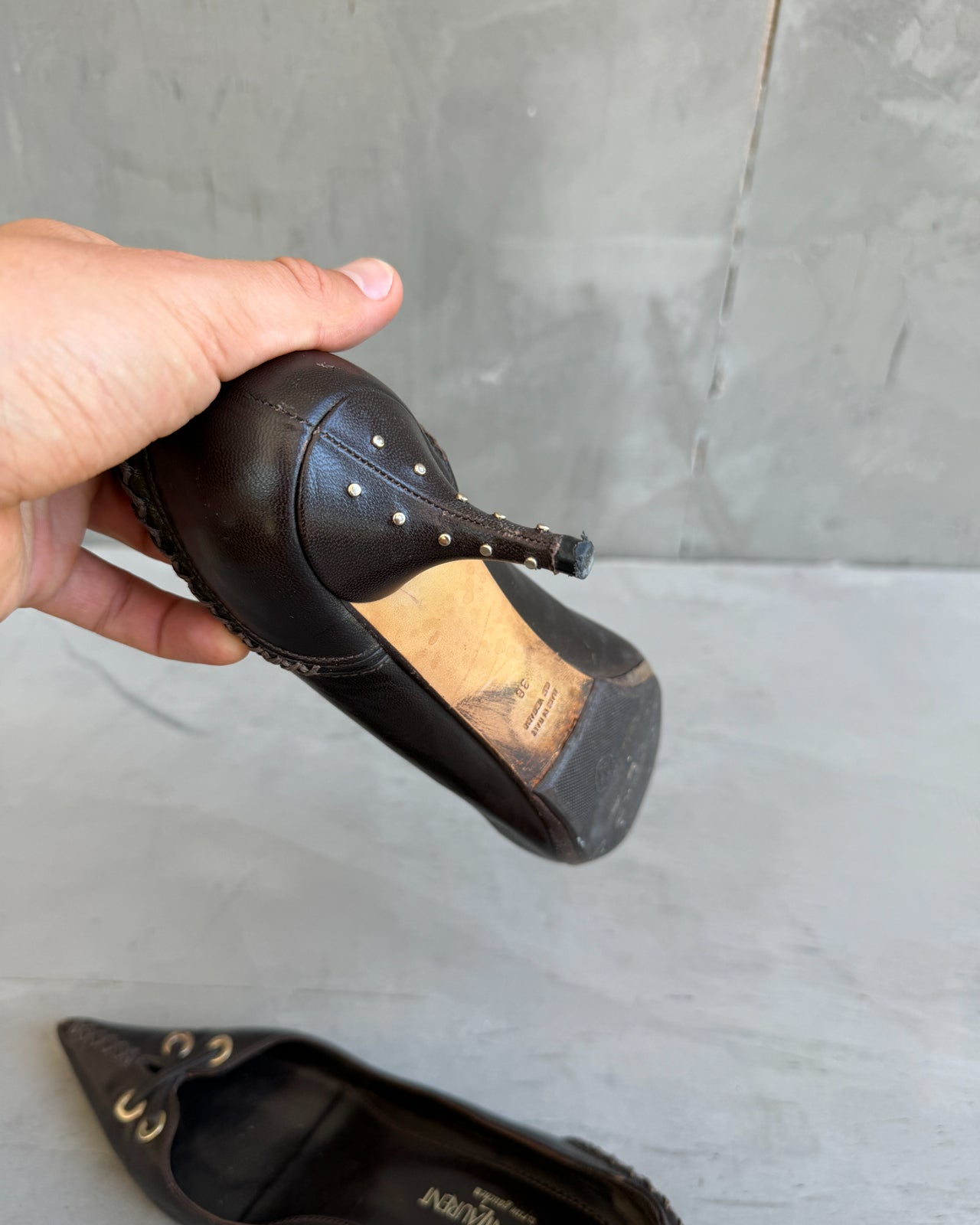 Yves Saint Laurent Rive Gauche Brown Leather Heels – EU 38-on a concrete background