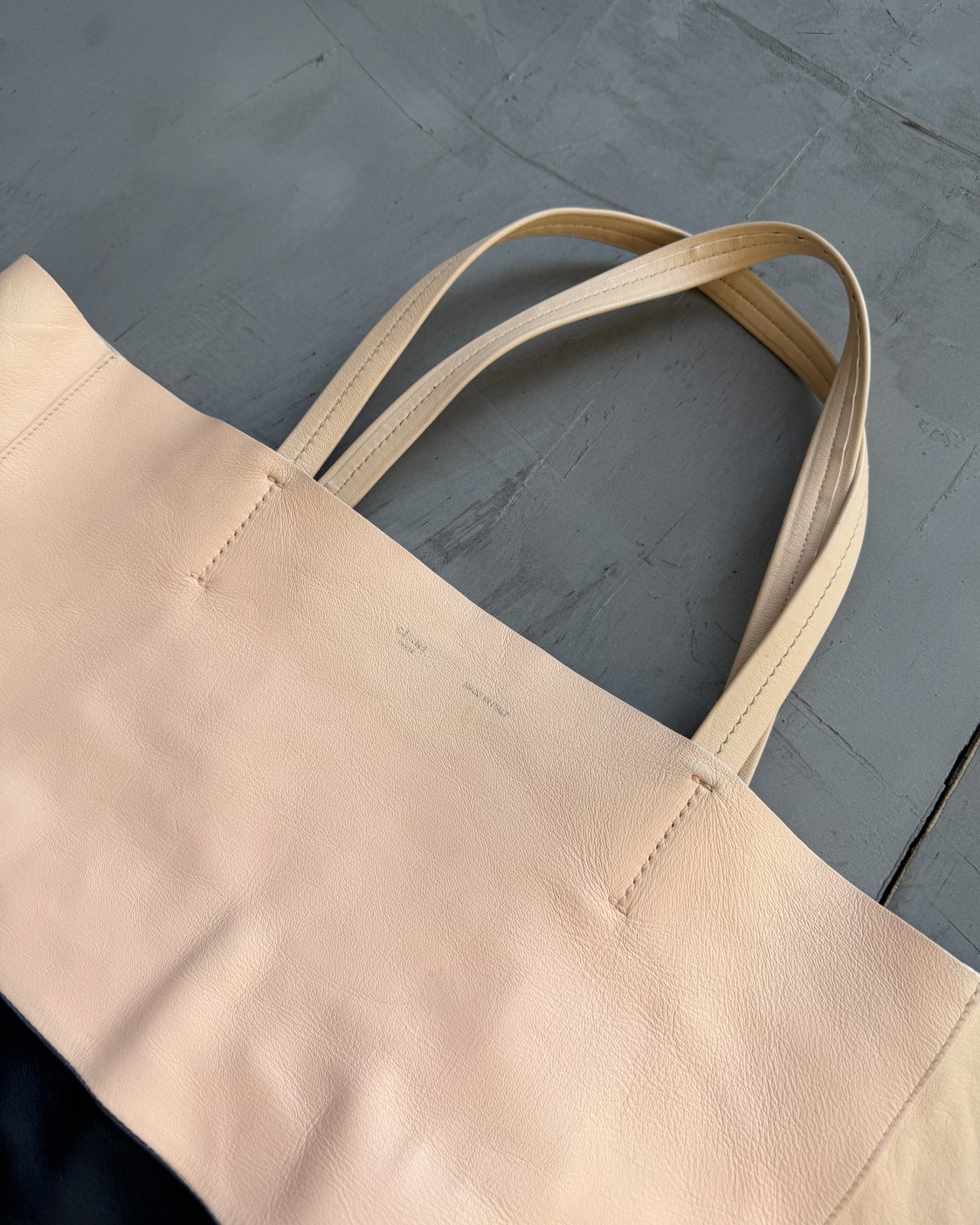 Celine Two Tone Leather Tote Bag-on a concrete background