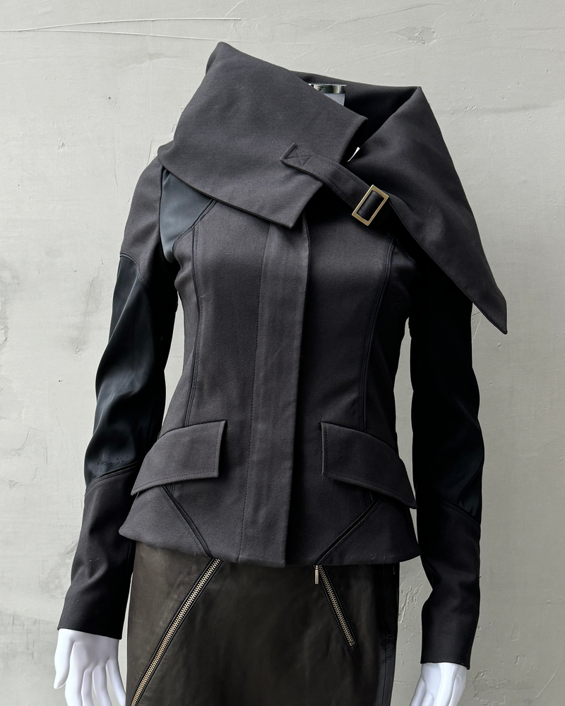 a photo of a gucci by tom ford fw 2003 jacket, with a high neck collar and corseted waist. Tom ford gucci 2003