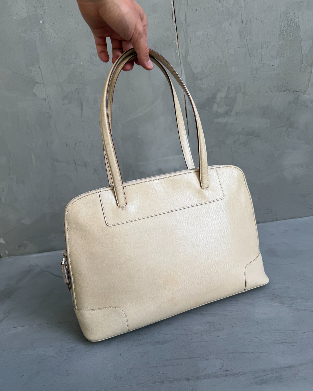 Gucci Beige Structured Leather Handbag-on a concrete background