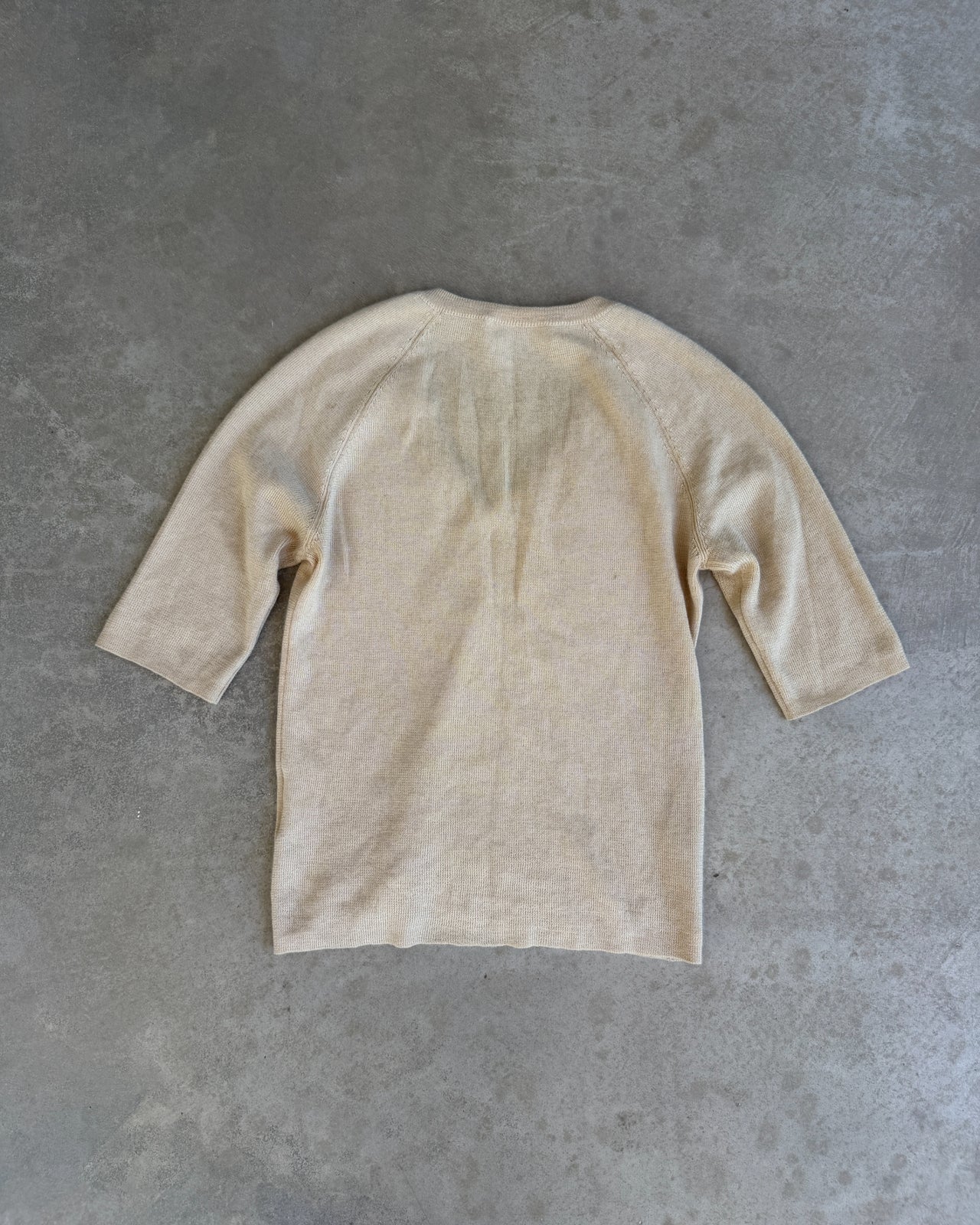 Prada Cashmere Silk Blend V Neck T-Shirt – S-on a concrete background