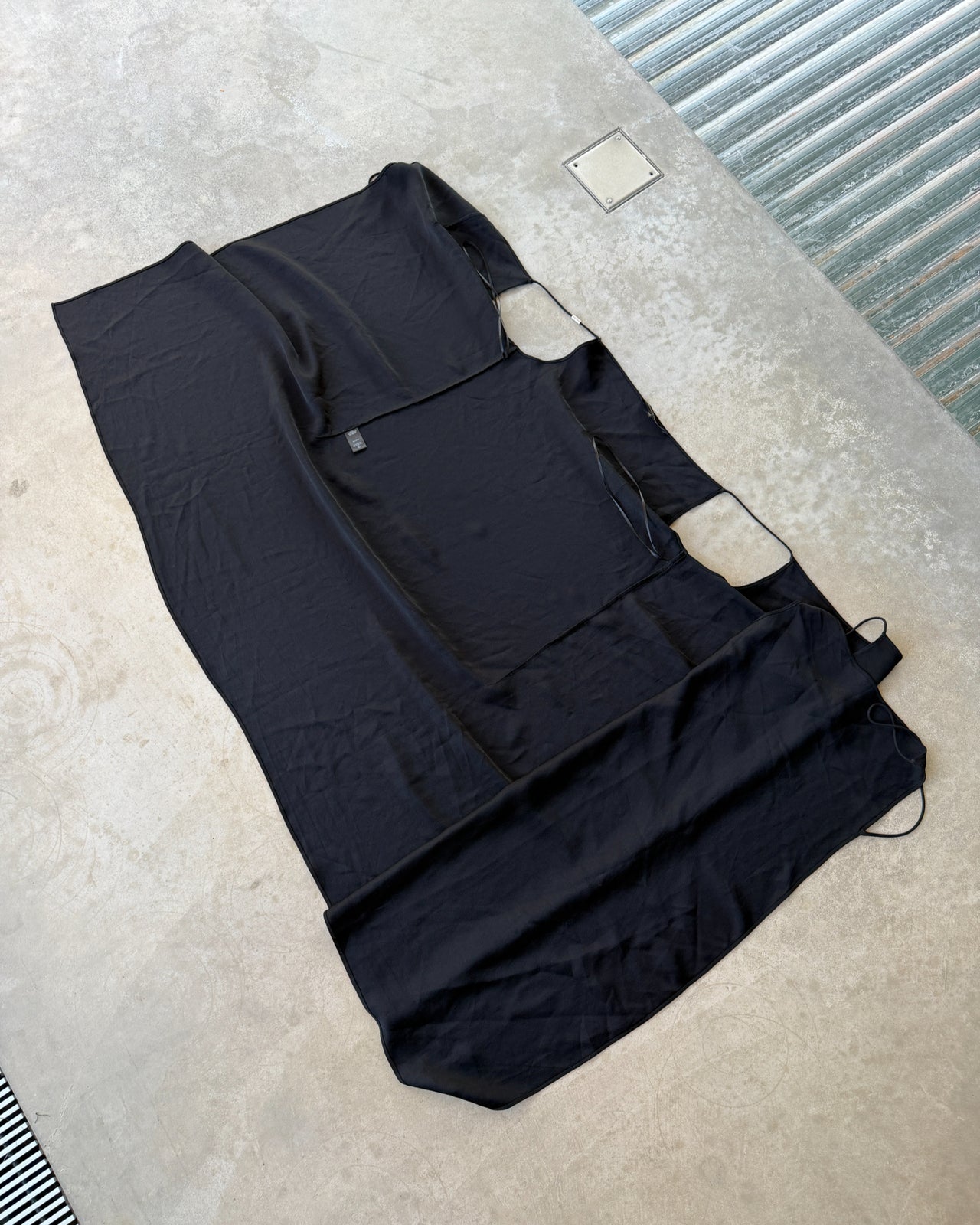 Francisco Costa for Calvin Klein Black Wrap Panel Dress-on a concrete background