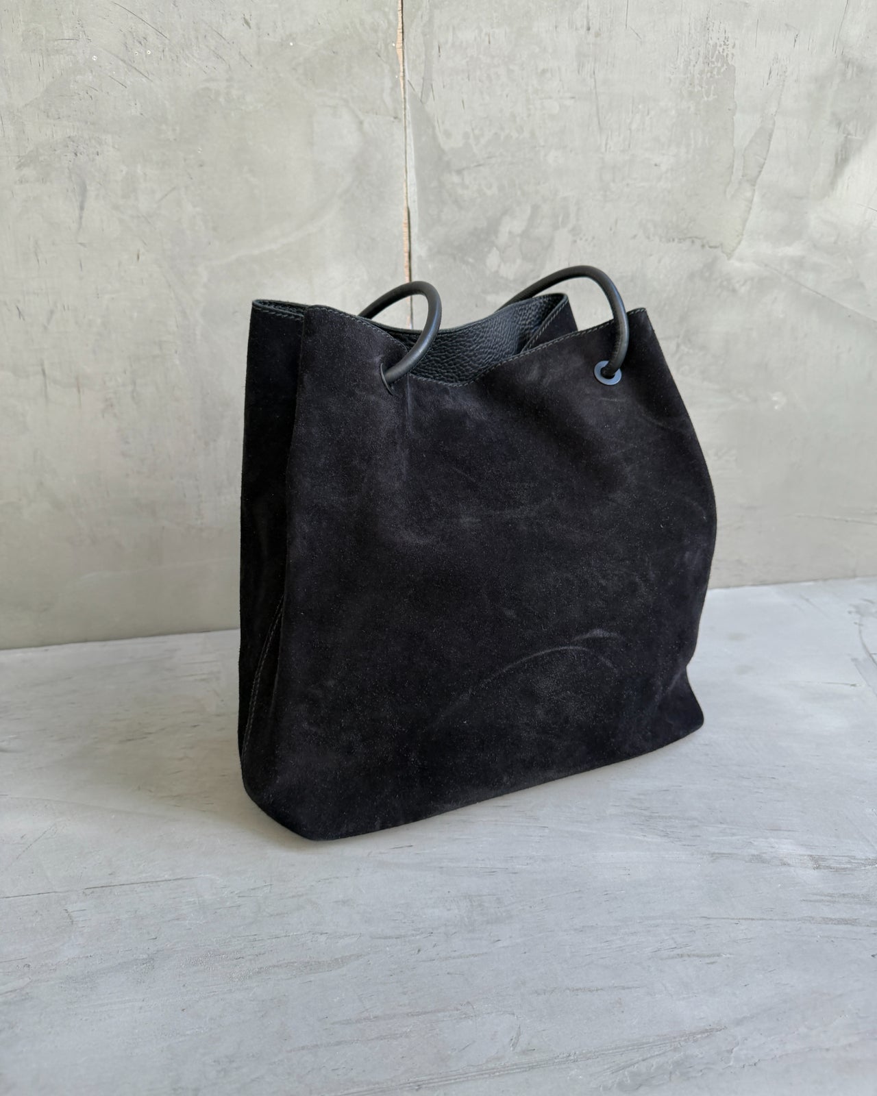 Gucci by Tom Ford Black Suede Leather Shoulder Bag-on a concrete background