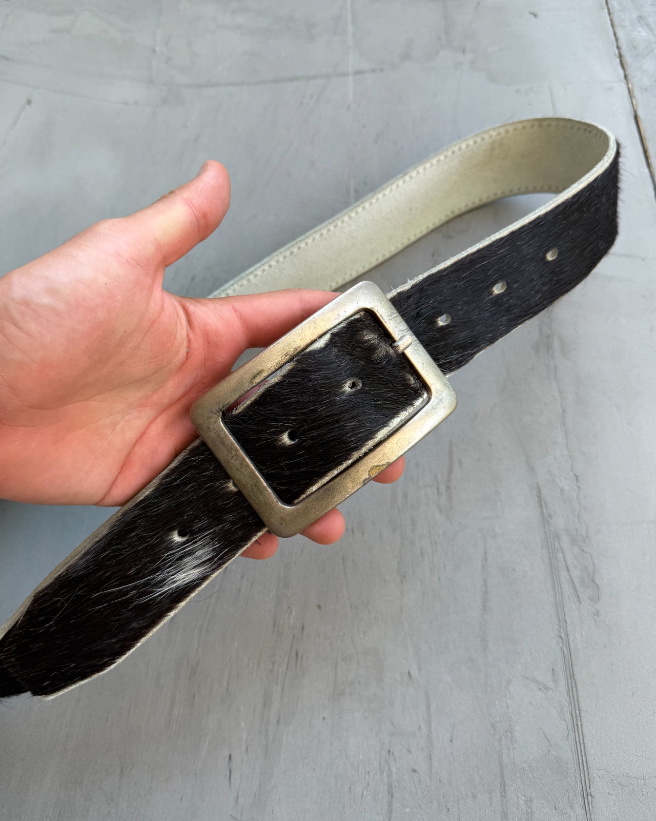 Brown Leather and Pony Hair Belt-on a concrete background
