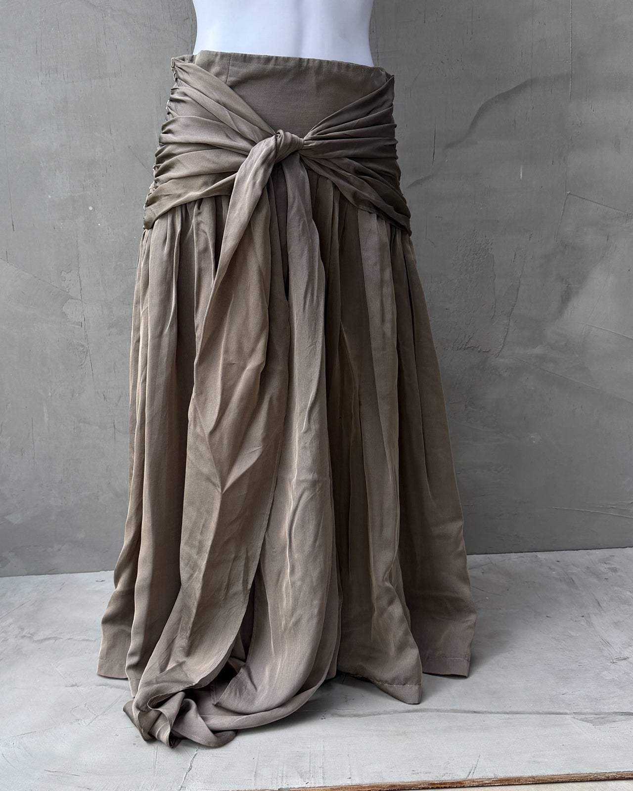 Loewe Silk Pleated Wrap Tie Waist Midi Skirt – S/M-on a concrete background
