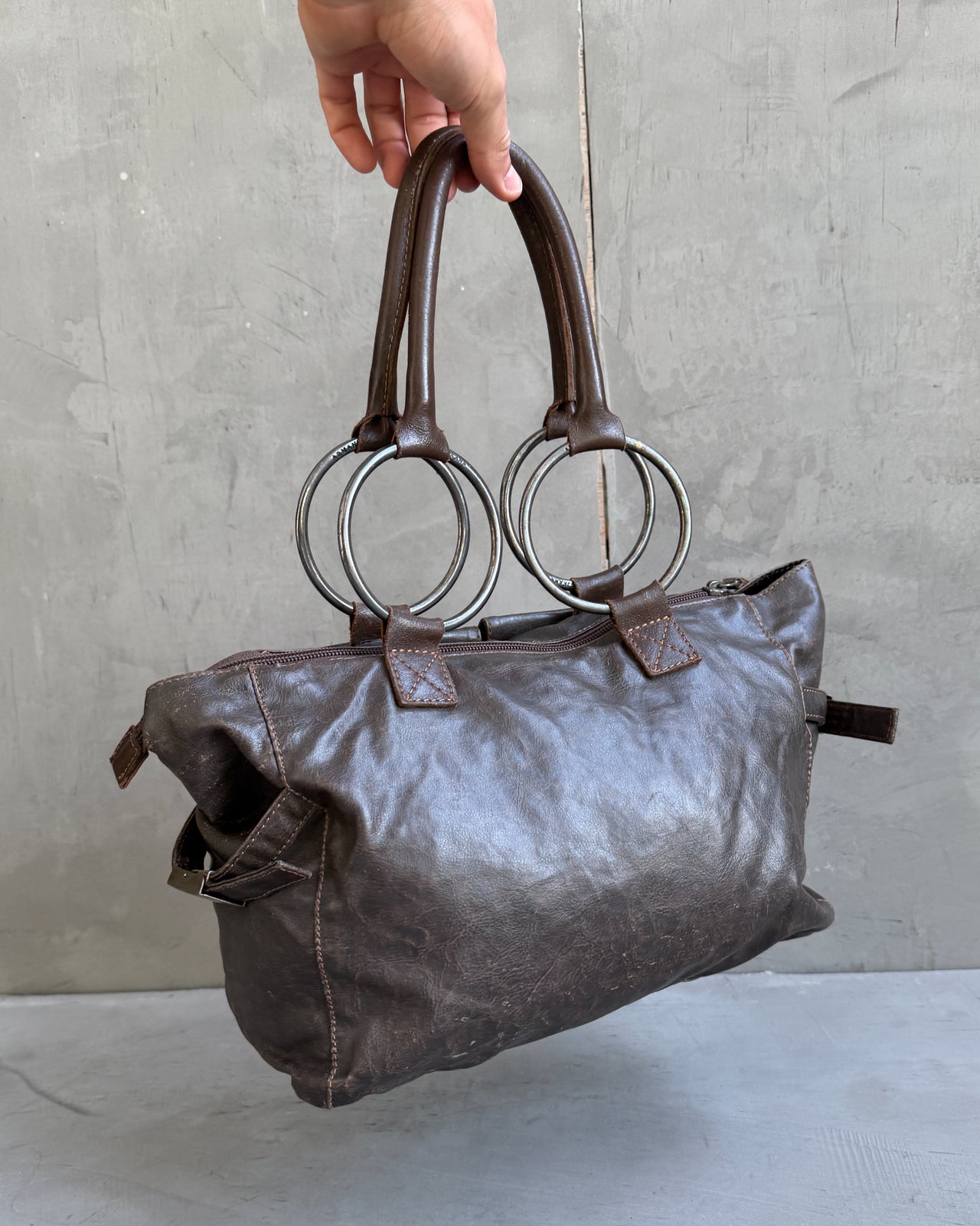 Armani Jeans Brown Leather Handbag-on a concrete background