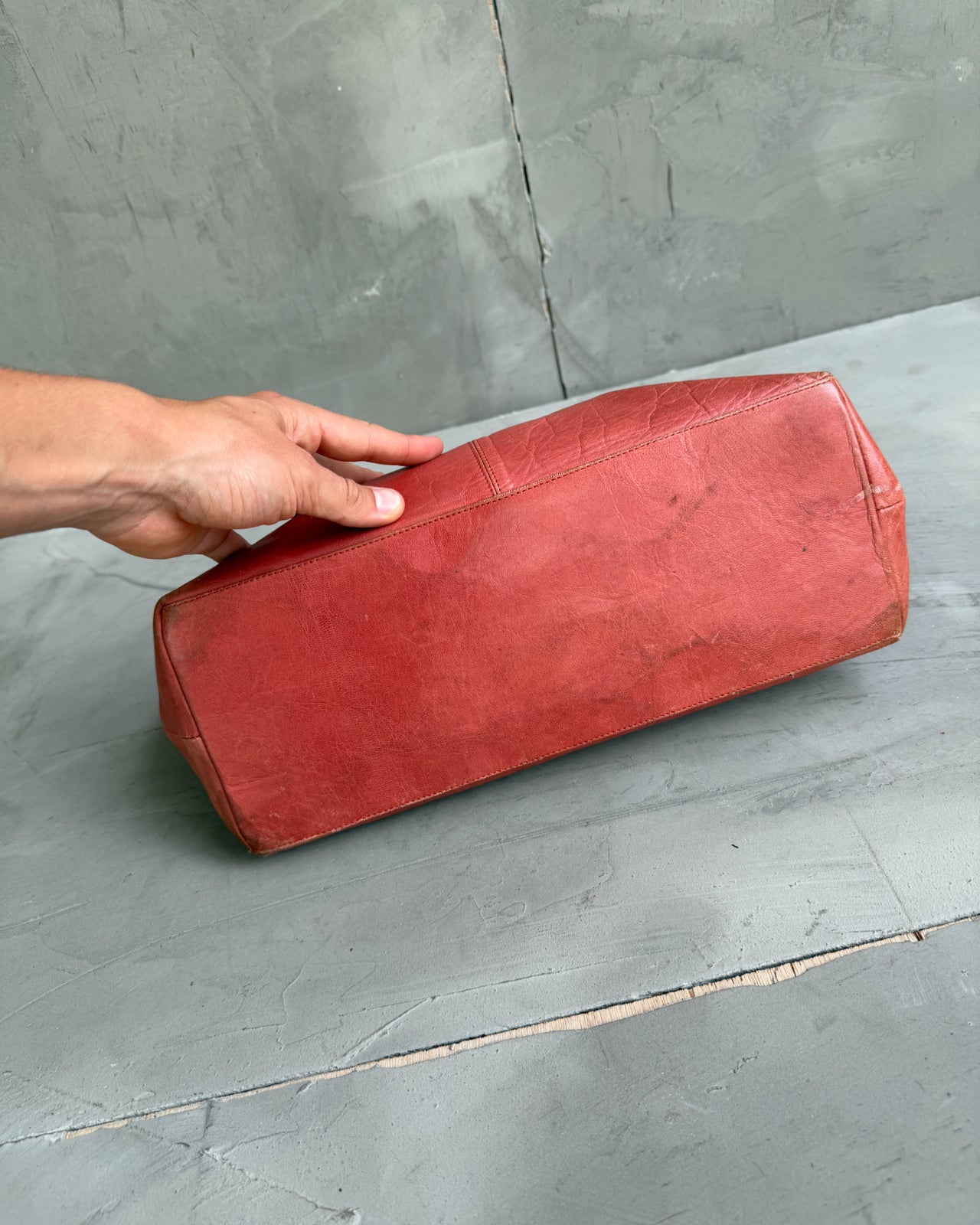 Muxart Leather Handbag-on a concrete background