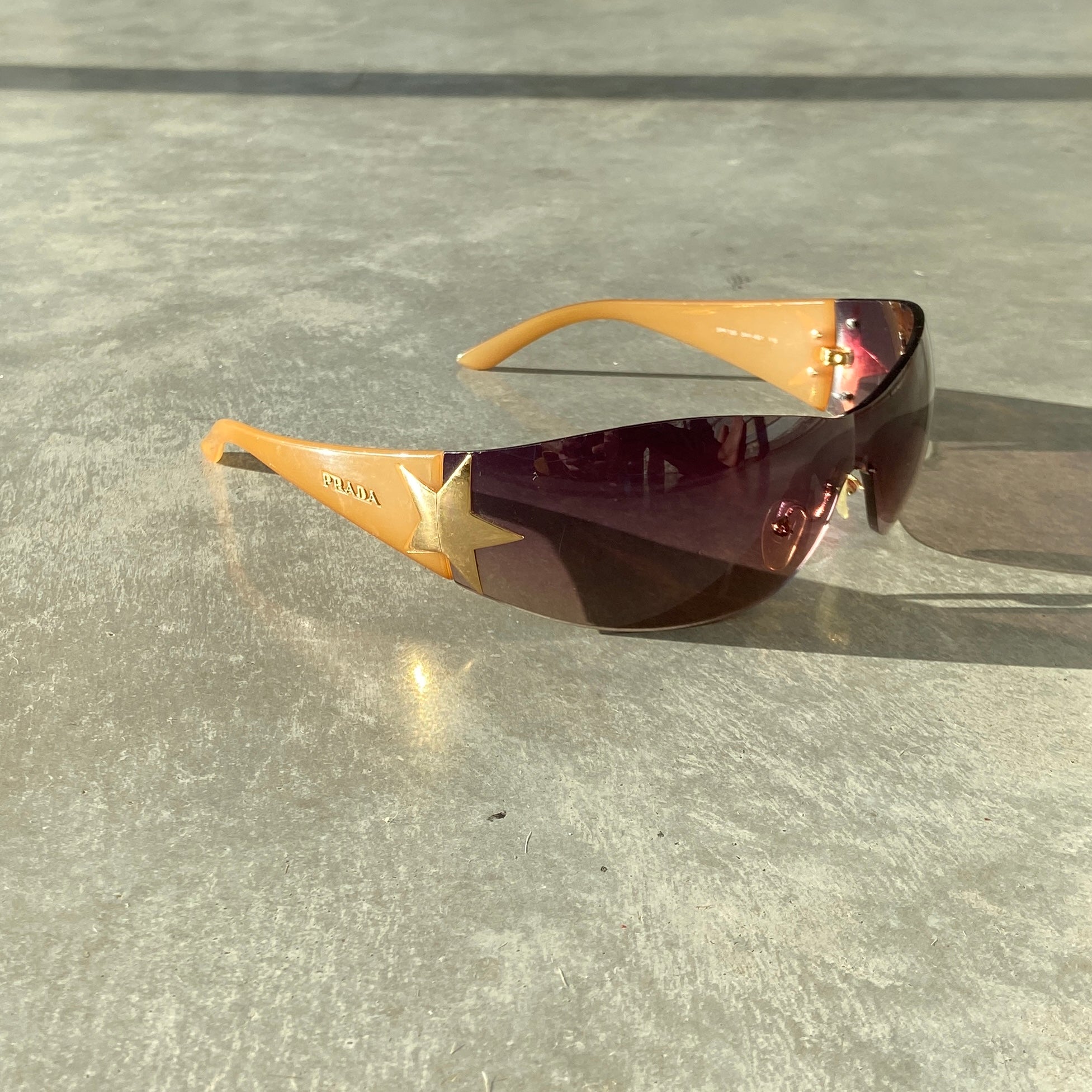 PRADA WRAP AROUND STAR SUNGLASSES