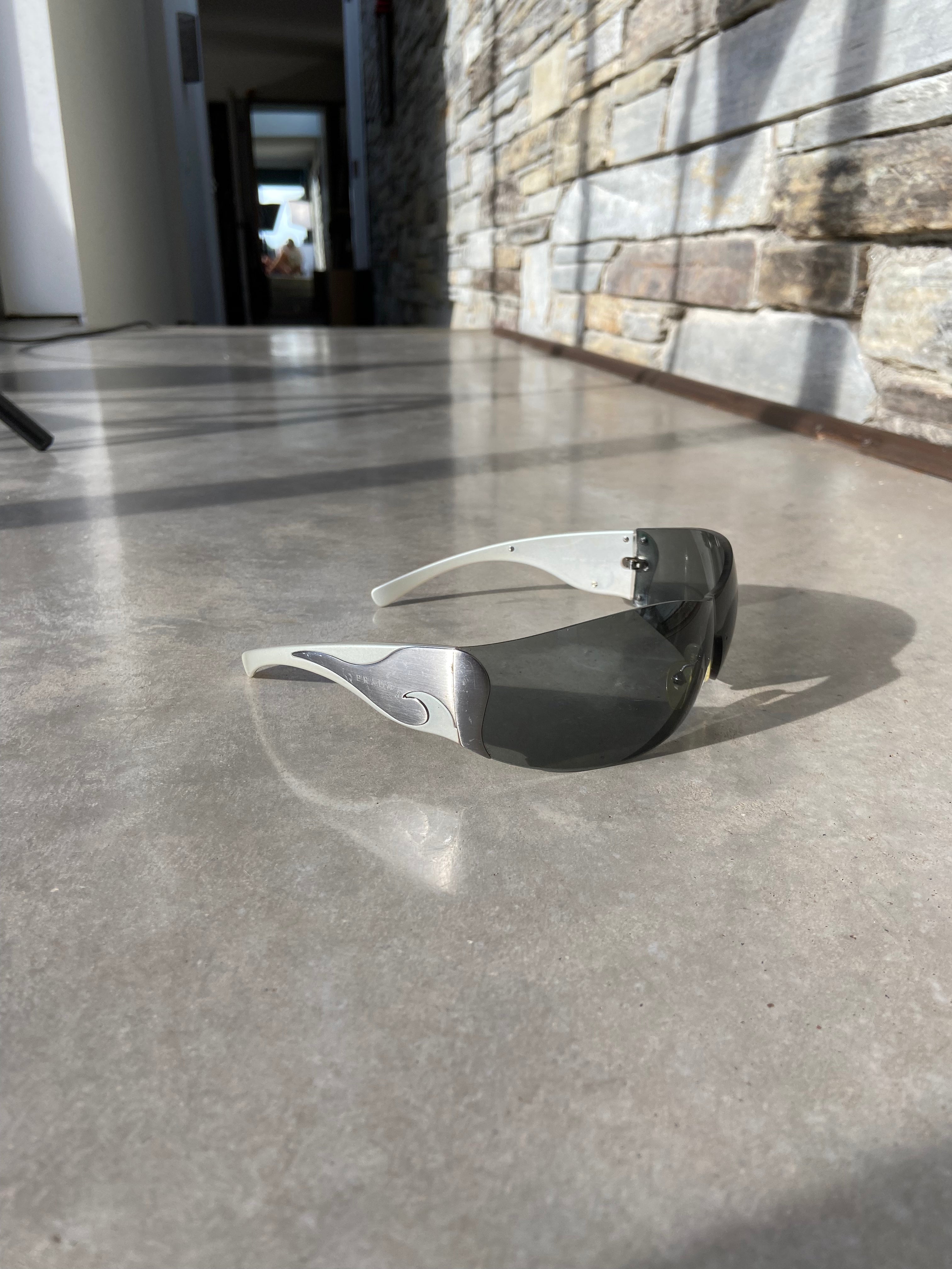 PRADA WRAP AROUND SWIRL SUNGLASSES