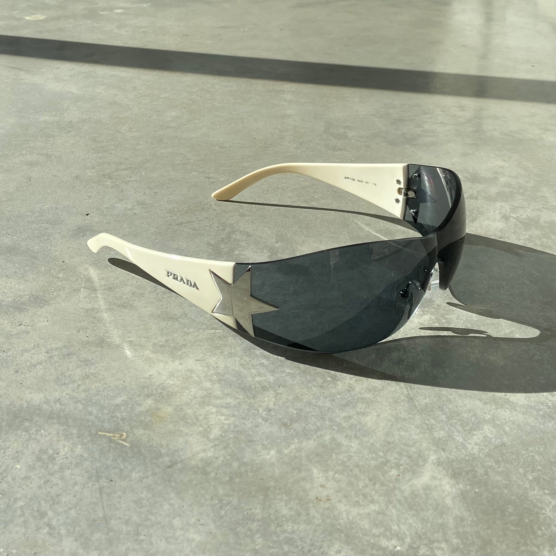 PRADA WRAP AROUND STAR SUNGLASSES